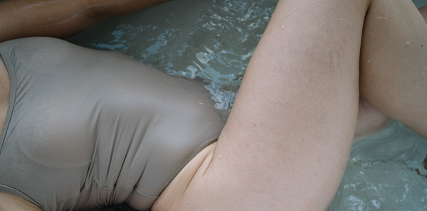 A woman bathing in a swimsuit.