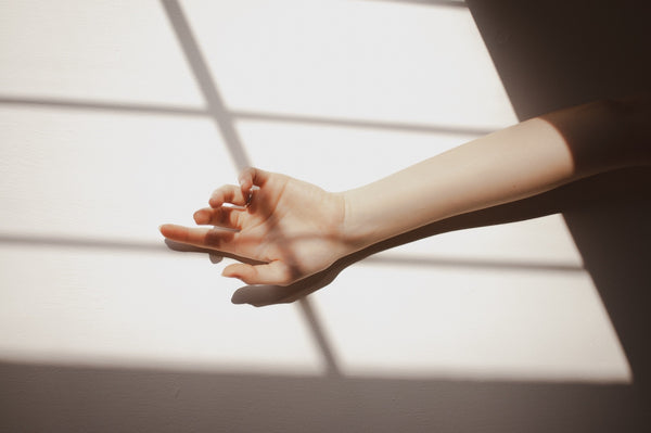 hand-reaching-out-from-shadows